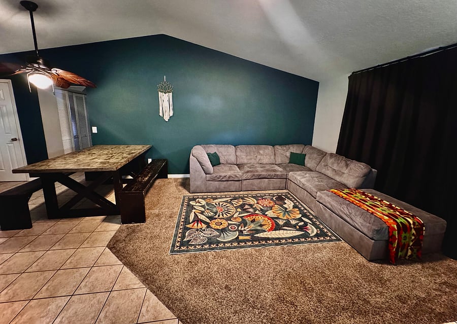 Seating for up to 12 guests, with a clear view of the smart TV.
