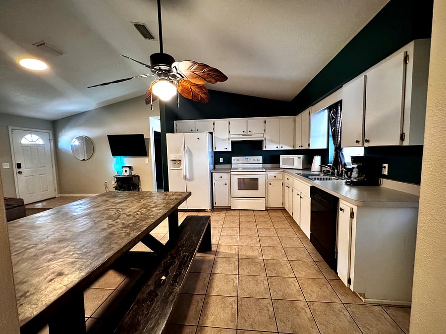 Kitchen view from side door entry hallway.