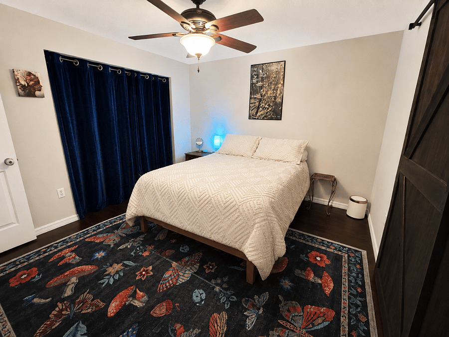 Master Bedroom with Queen Bed from Barn Door- Entrance from Bonus Suite and Master Bathroom