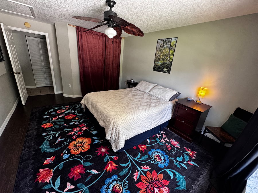 Spare Bedroom 1 with Queen Bed View from the Window ft. Closet + Entry Door