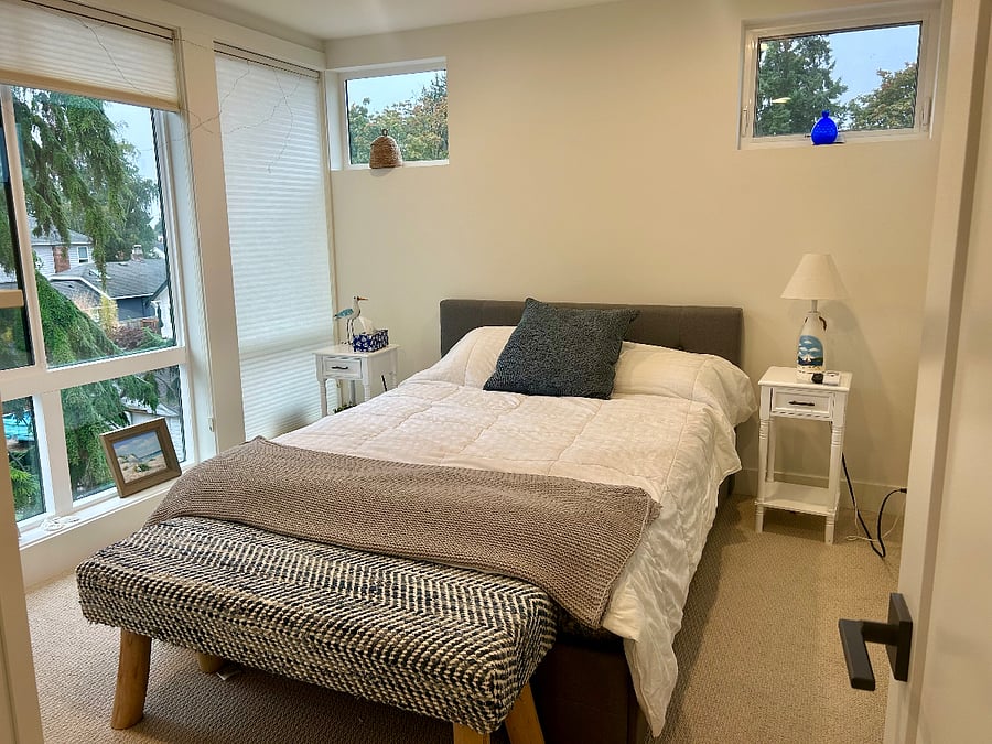 Master bedroom with territorial view. Floor to ceiling windows with custom shades throughout townhouse