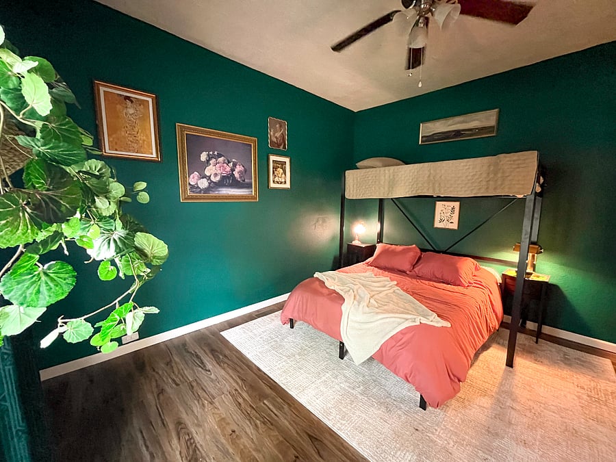 A cozy lofted twin bed with memory foam mattress topped with a soft coverlet sits comfortably beneath tall ceilings, making the upper bunk feel open & inviting. 