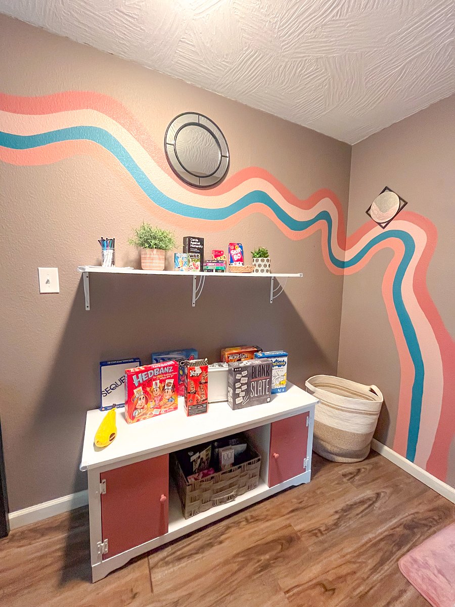 Dive into our curated game library with board games, card games, and puzzles--all set against the backdrop of a hand-painted mural. Check the cabinet for outdoor fun - jump ropes, chalk, bubbles, frisbees, soccerball, etc! 