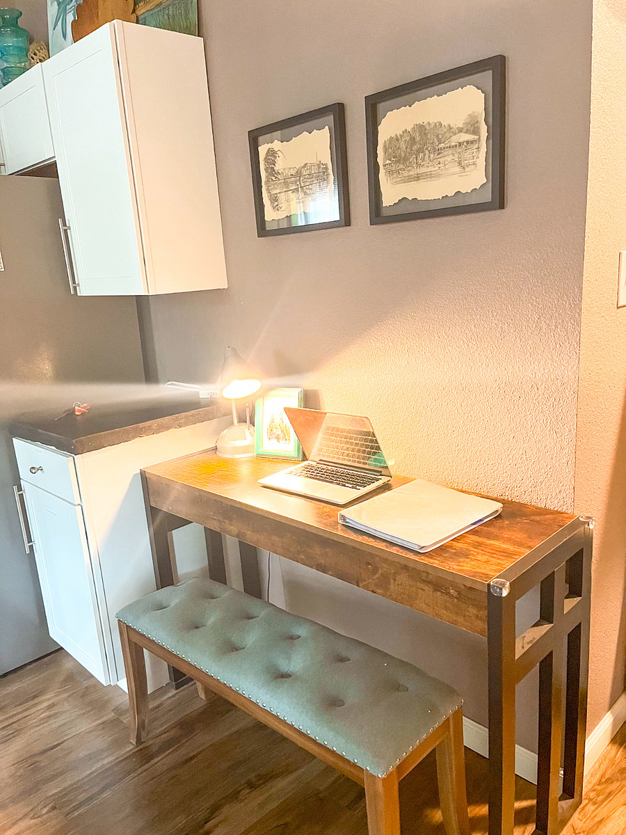 Need to get some work done? A well-lit workspace in the kitchen offers a quiet spot for remote work or planning your day with easy access to an outlet with USB ports. 