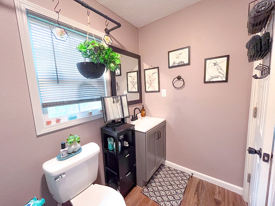 Alongside the large mirror & brand new sink, a lighted magnifying table mirror makes getting ready a breeze. Enjoy local art & thoughtful details that add charm & character to the space. 