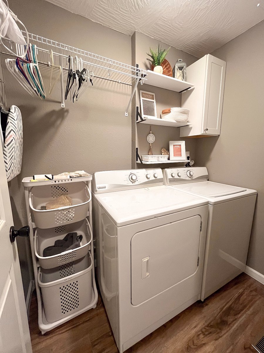 The laundry room is equipped with a washer and dryer, extra hangers, laundry essentials, an iron and ironing board, and a first aid kit for your peace of mind during your stay.