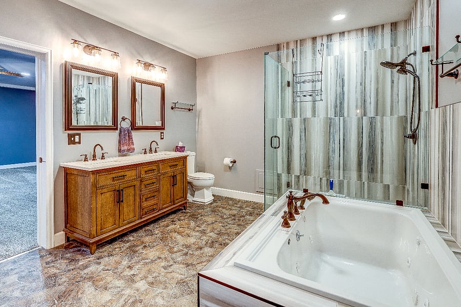 Basement private master bathroom suite with huge walk in shower, double vanity, High efficiency toilet and extravagant jacuzzi tub!