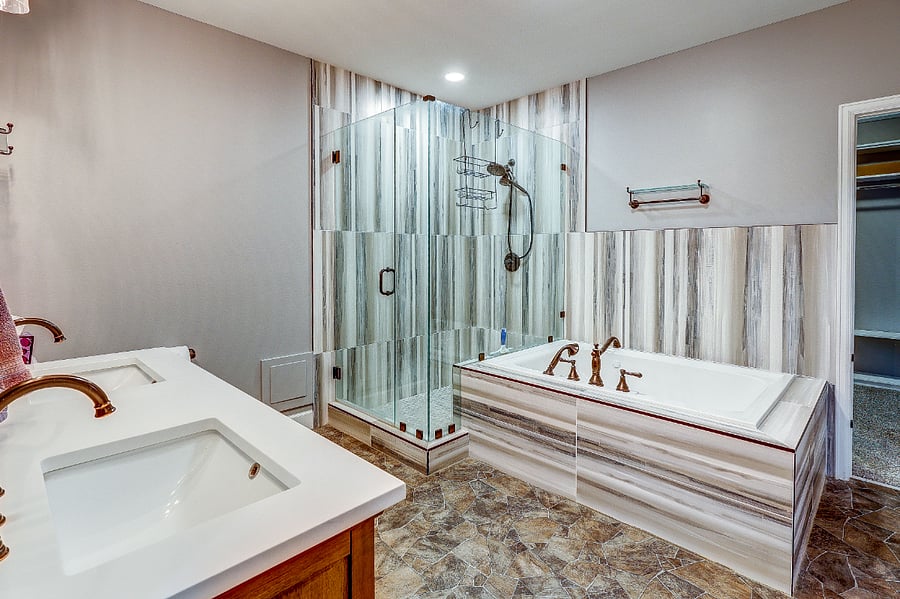 Second master bedroom suite off of master bedroom with jacuzzi tub and huge walk in shower plus double sinks and medicine cabinets!