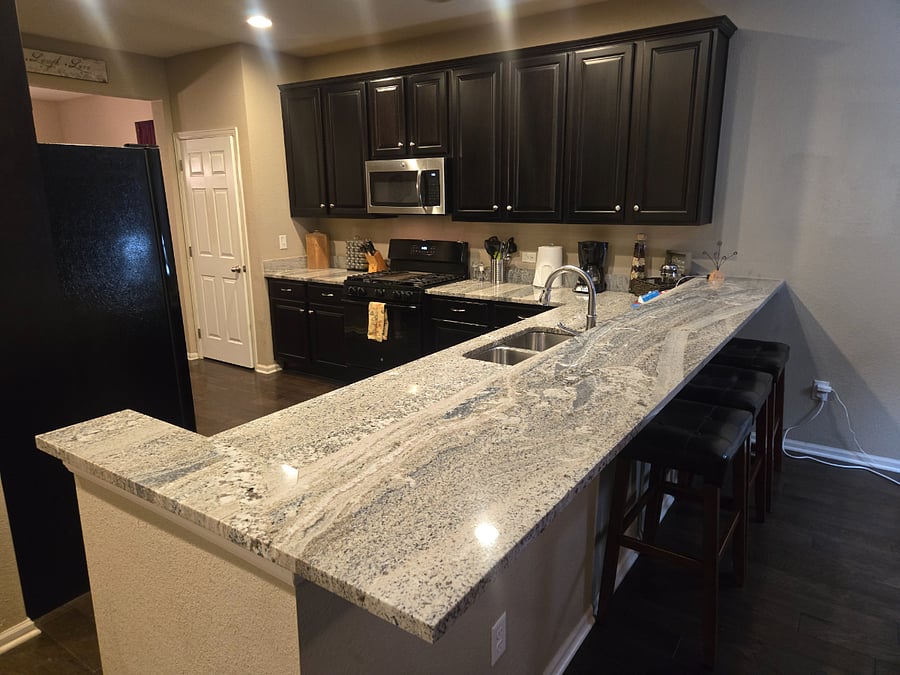Awesome breakfast bar off of kitchen! Fully stocked kitchen