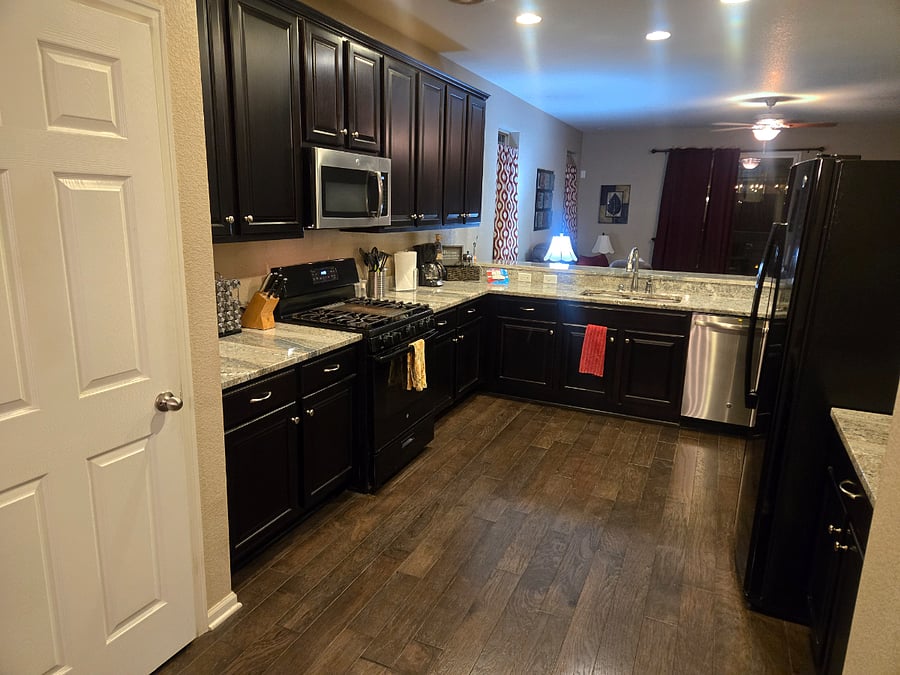 Huge kitchen space with tons of cabinets and open concept so it flows into the dining room and family room!