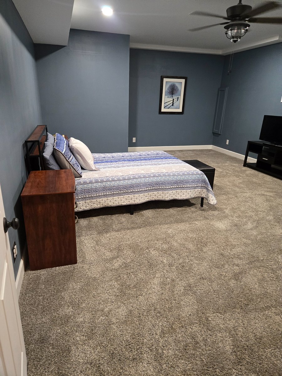 Ceiling fan/light along with can lights for maximum lighting! Queen size bed with TV and more room for just about anything!