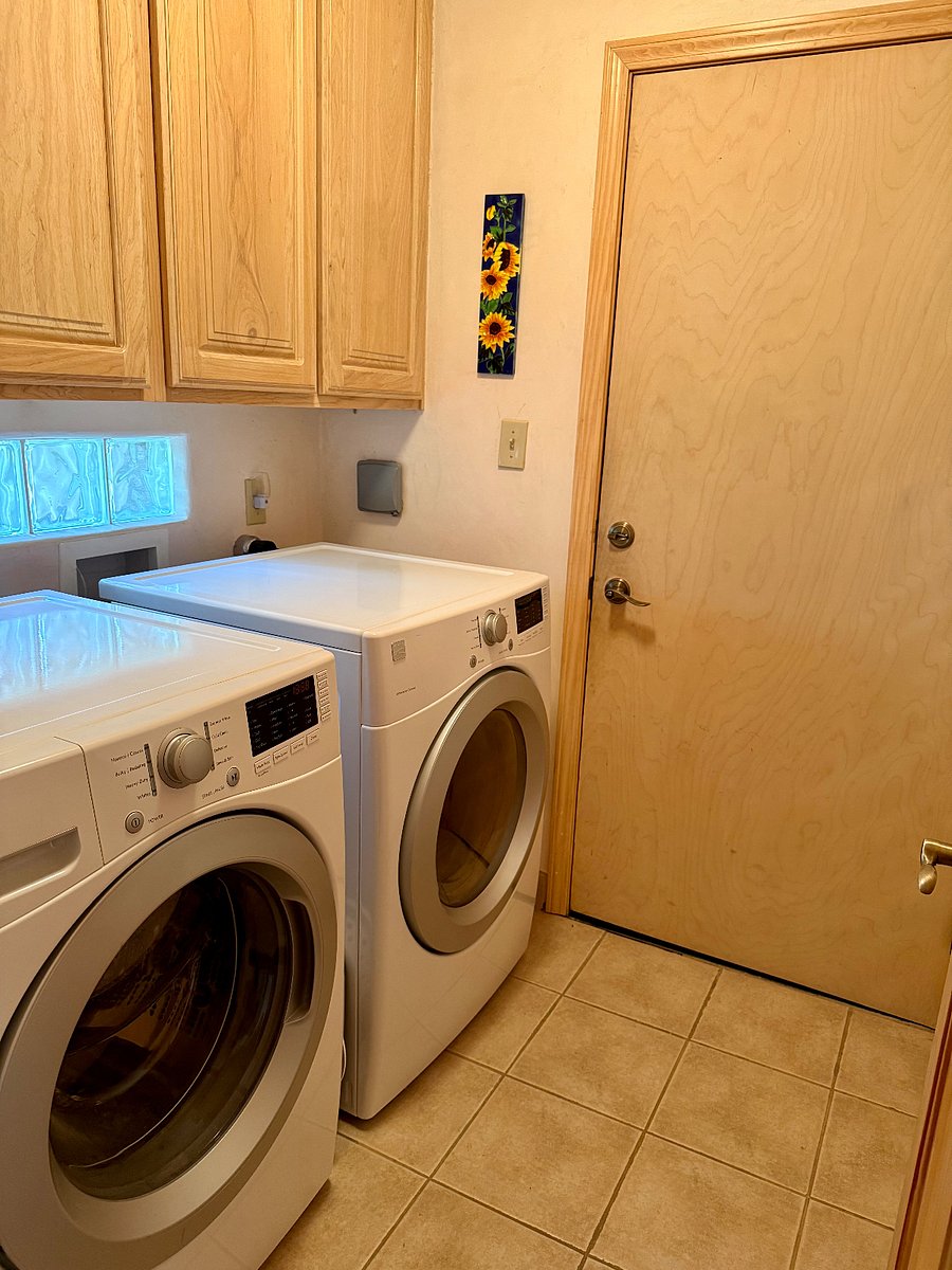 Full laundry room, between the garage and front hallway.