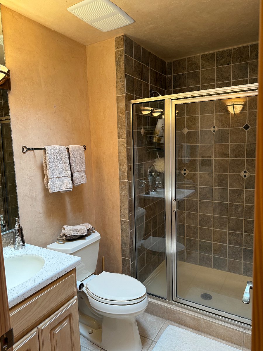 Guest bath with shower, located upstairs.