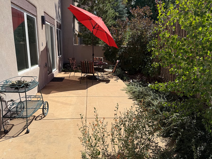 The patio off of the dining room is right-sized and private. This secluded outdoor living space is enjoyable year-round!