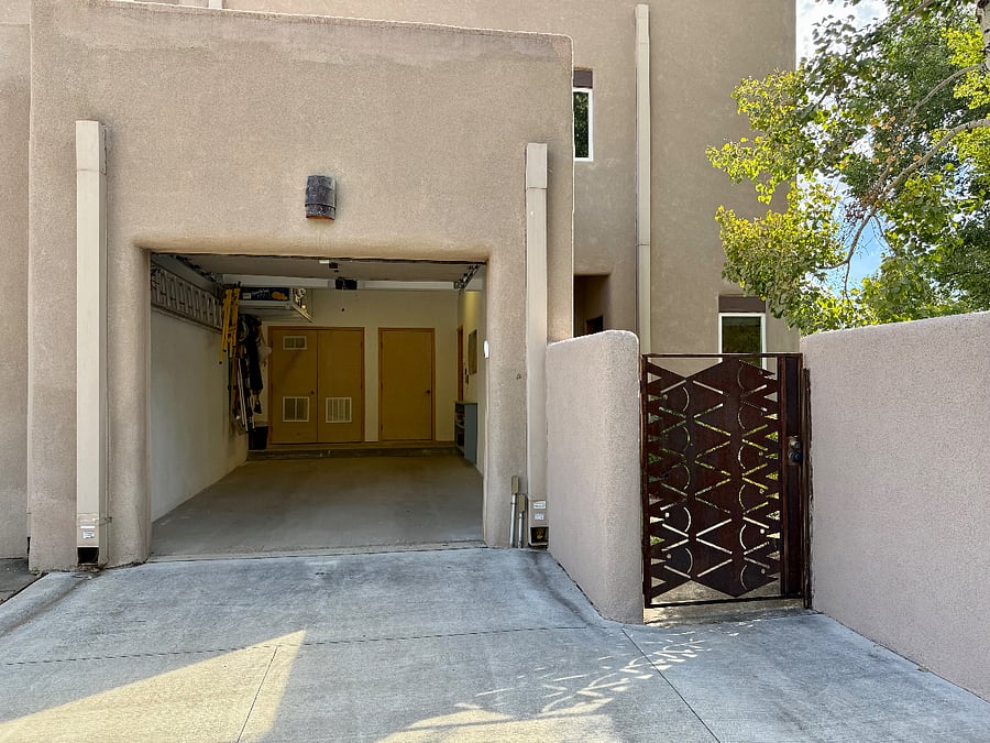 Photograph showing the inside of the single-car garage with 240 Volt EV charging available.