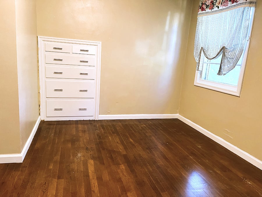 Queen bedroom with built in dresser