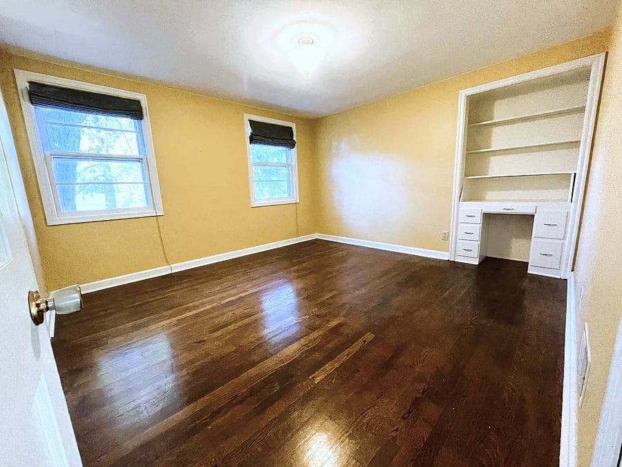 King bedroom with built in desk