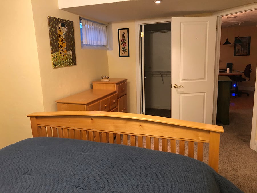 Downtairs bedroom, quiet and cool in summer with electric fireplace for extra comfort in winter. Comfortable queen mattress, full dresser and small closet.