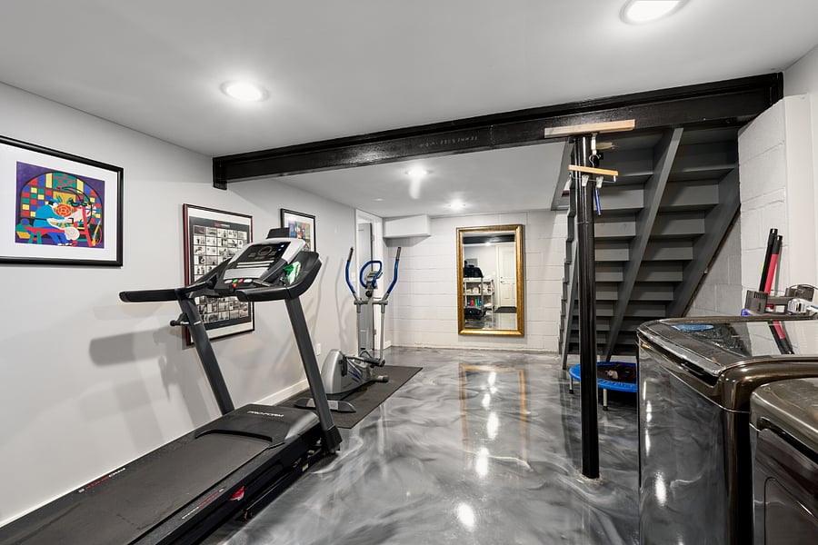 Gym equipment in laundry room area