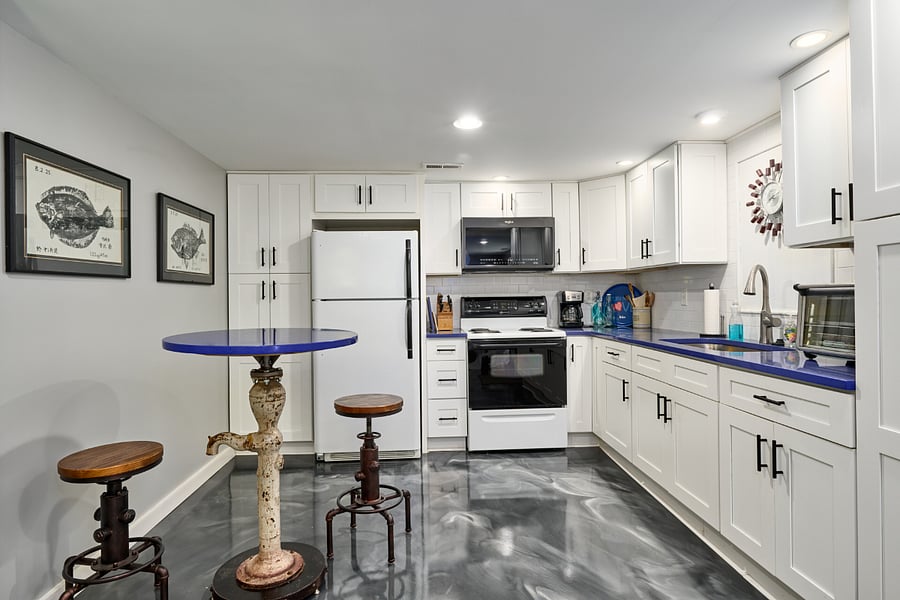 Kitchen with full size refrigerator and stove