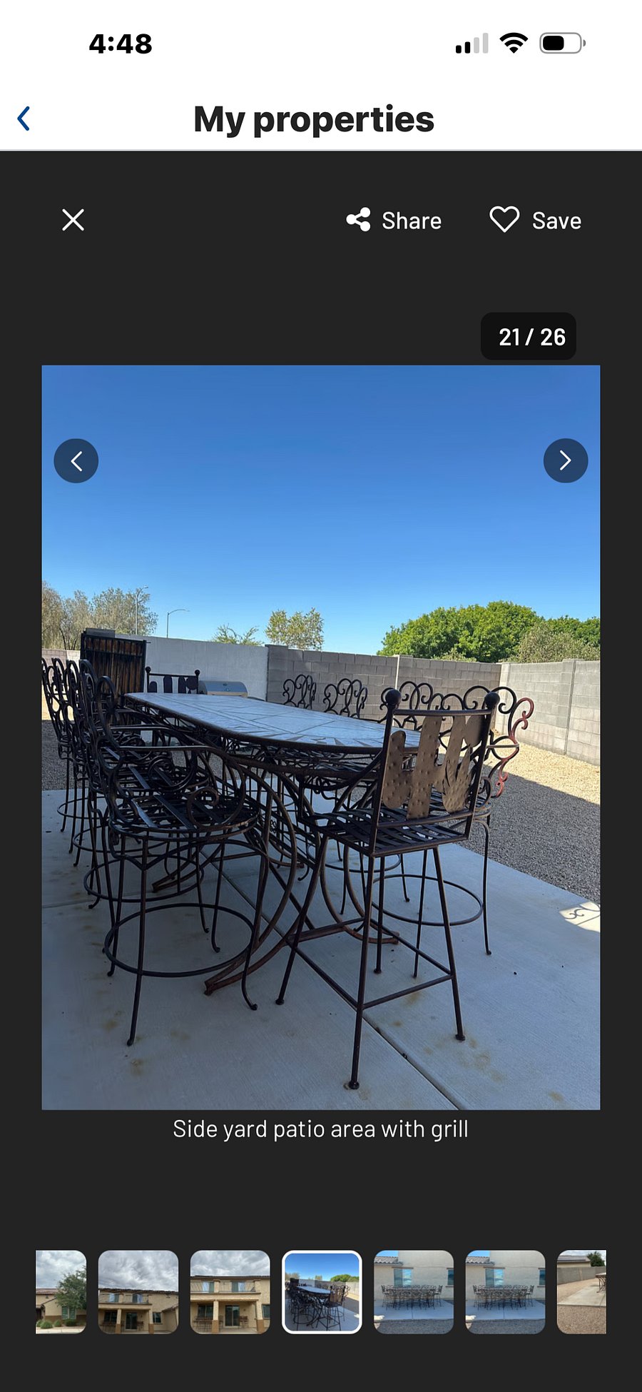 Side yard with patio table and chairs