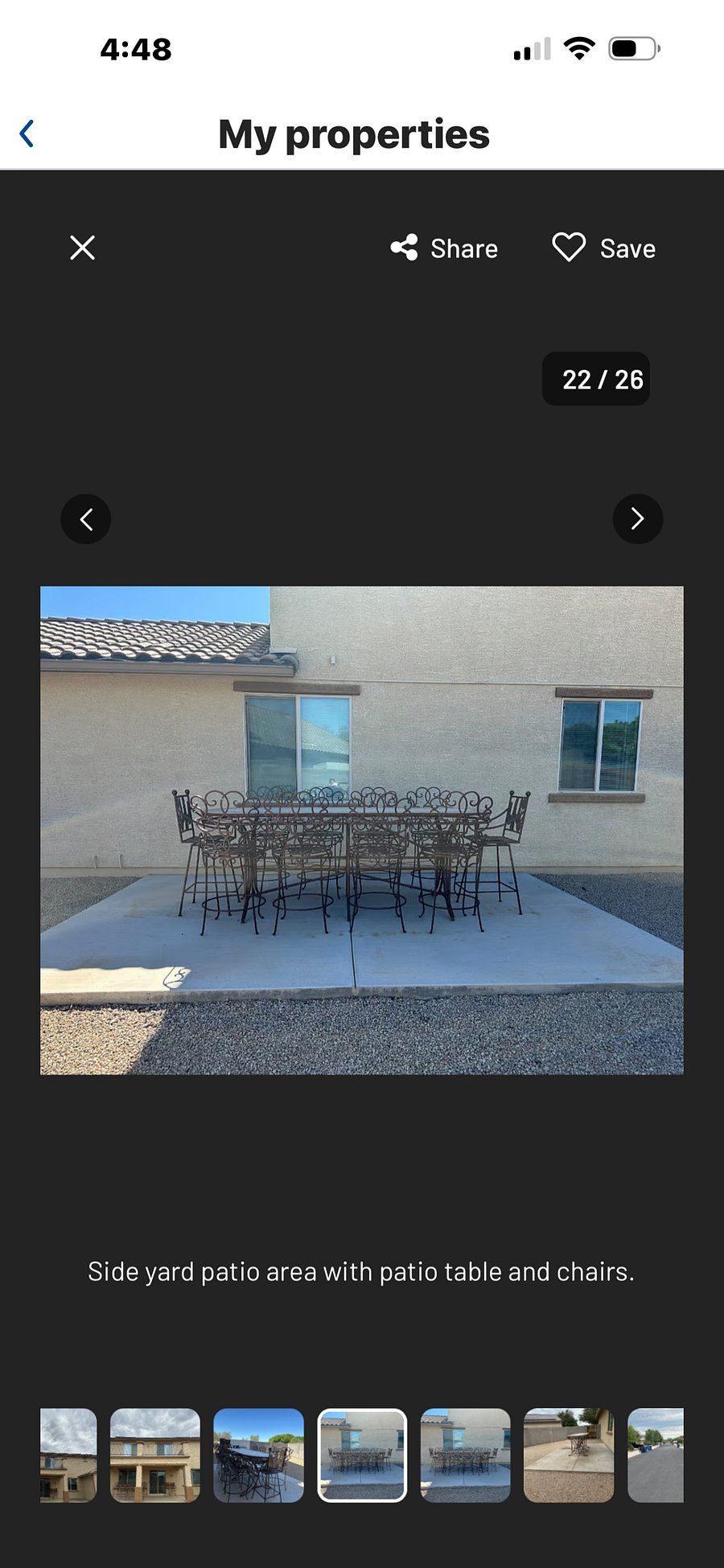 Side yard with patio table and chairs