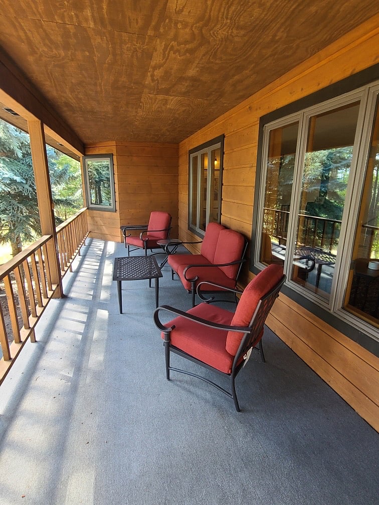 Enjoy the deck overlooking the property and lake view--perfect for morning coffee and reflection. 