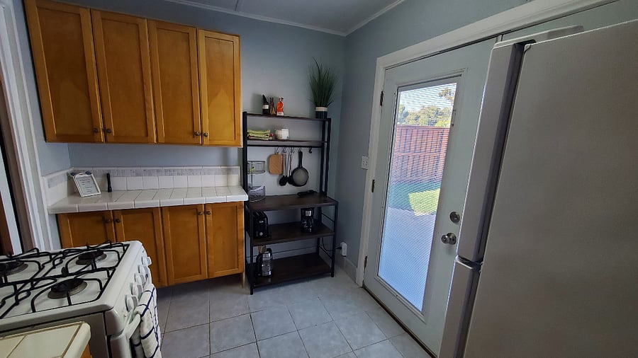 Kitchenette view from bathroom to front door