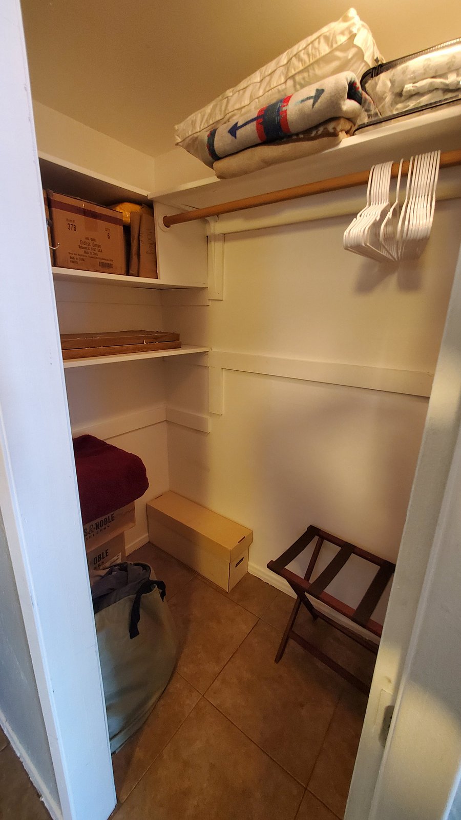 Walk in closet (left side) with shelving