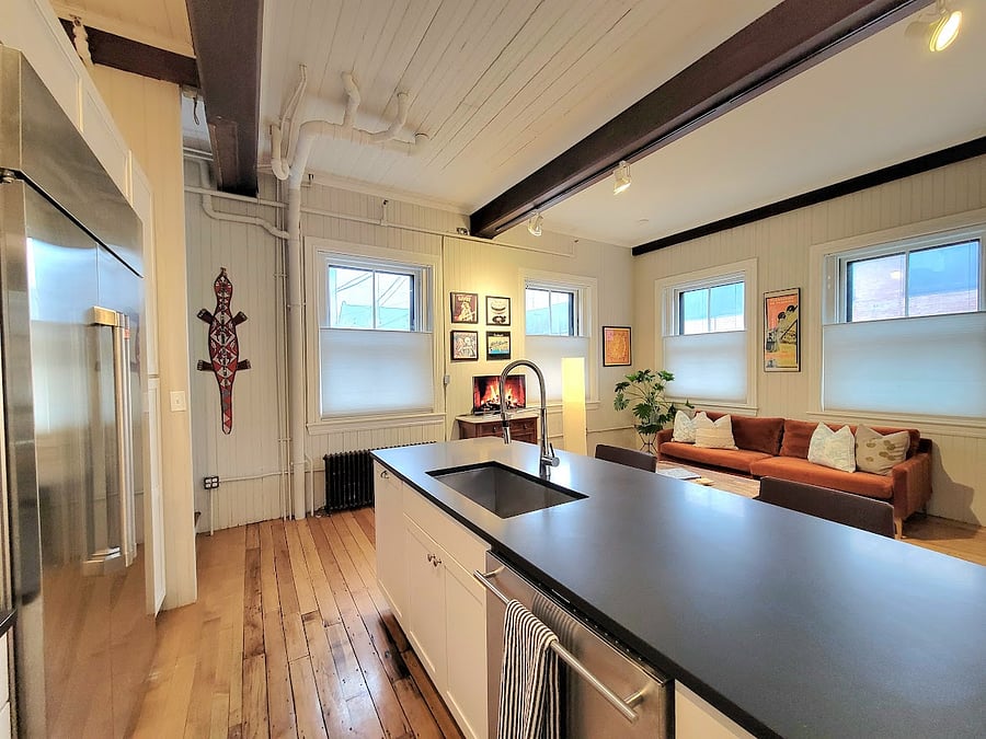 Grand open air space as you walk in. Area to lounge, entertain, or work all in one. Grand kitchen island, gourmet kitchen appliances and a modern look.