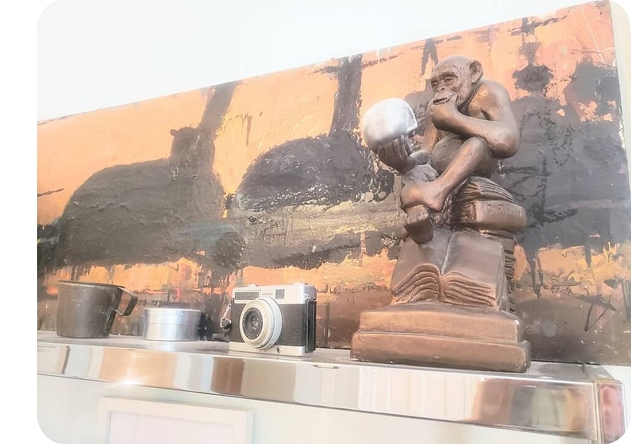 Creative original art, antiques add thoughtful character to this loft.