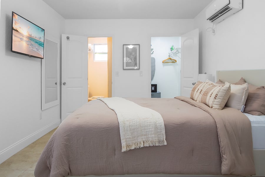 Quiet and spacious bedroom, bathroom, and walk-in closet. Featuring a queen bed, smart TV, blackout curtains, and a kitchenette!