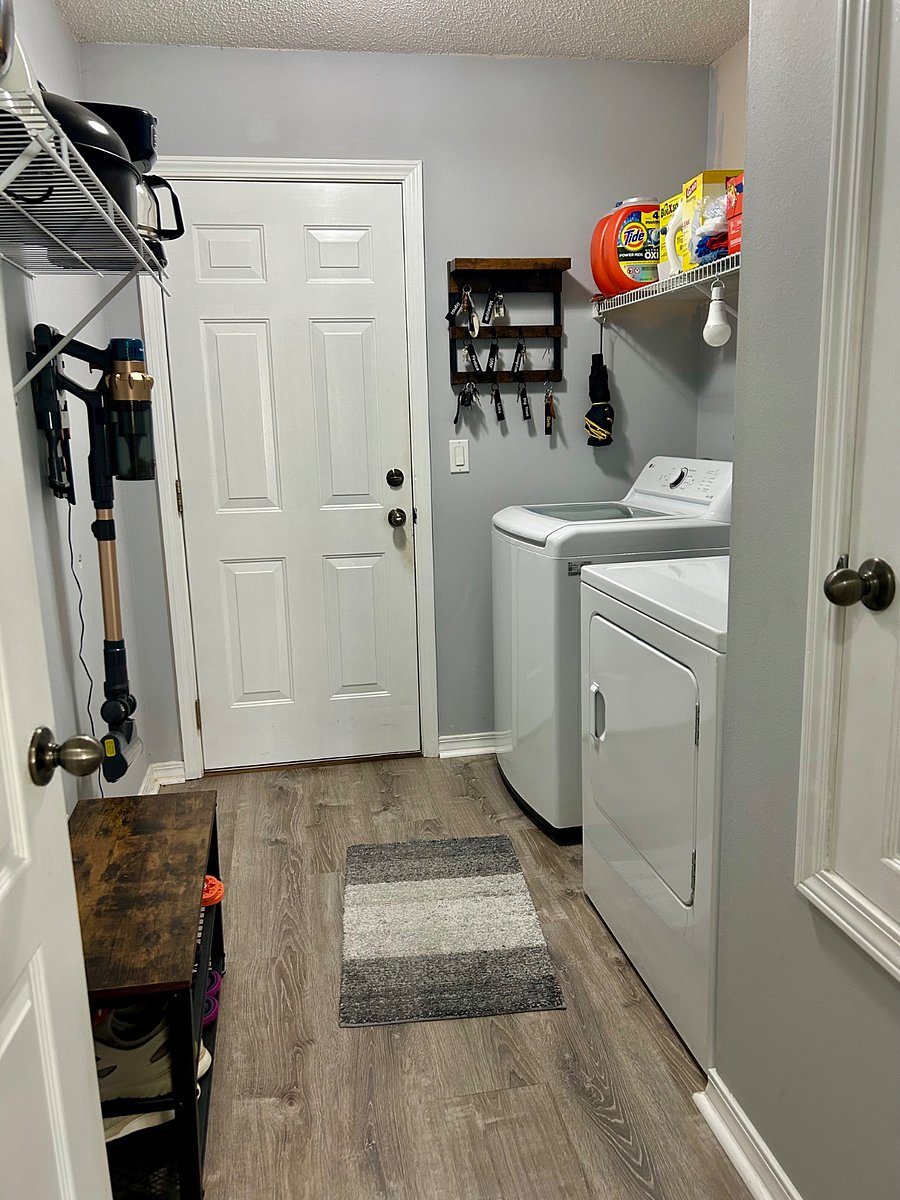 Laundry room with large capacity, washer and dryer.