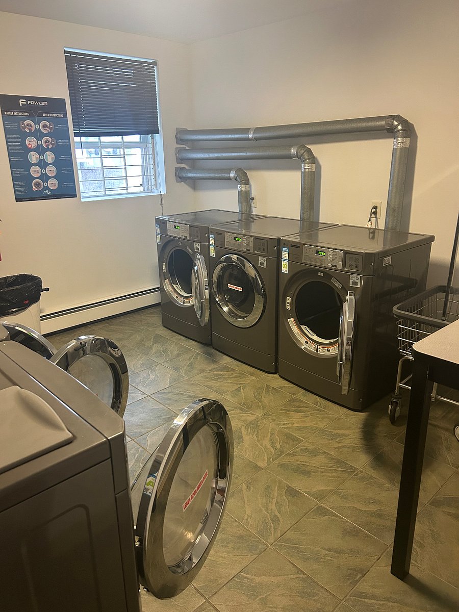 Washer and dryers located across the hall from apartment 