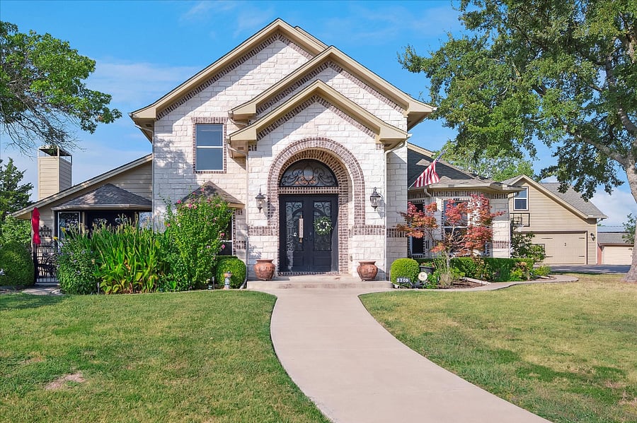 Spacious French country-inspired main entrance that welcomes you into the home