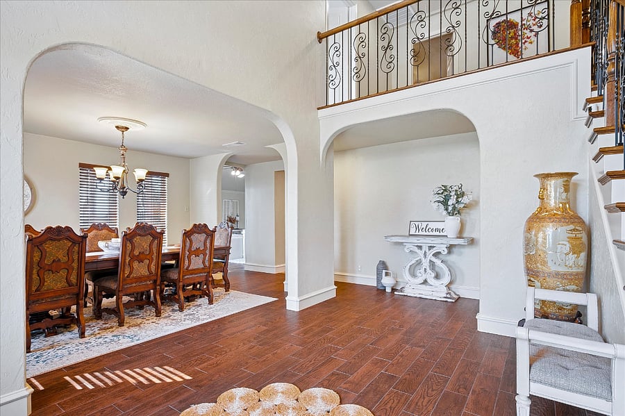 Elegant entryway with soaring high ceilings, creating a bright and welcoming first impression