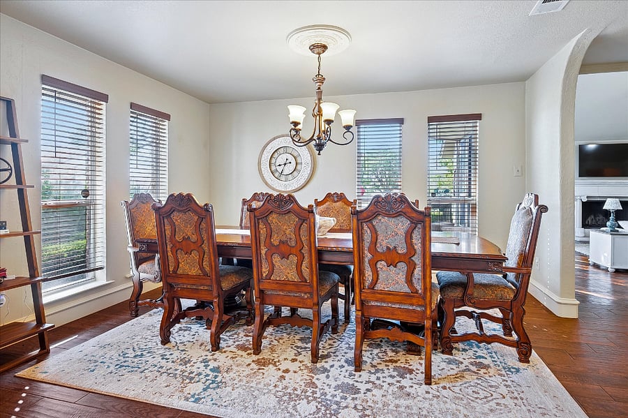 Elegant formal dining room with serene pond viewsperfect for hosting, entertaining, and celebrating special occa
