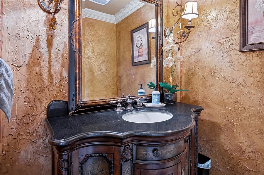Elegant powder room conveniently located on the main level for guests ease and comfort.