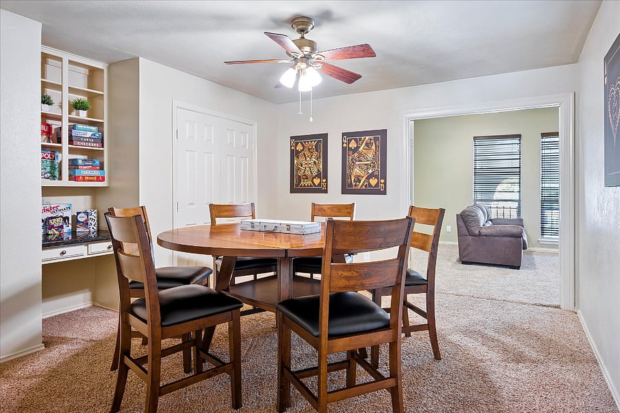 Inviting game room stocked with board games, books, and reading materials for all ages, perfect for family fun and quiet relaxation