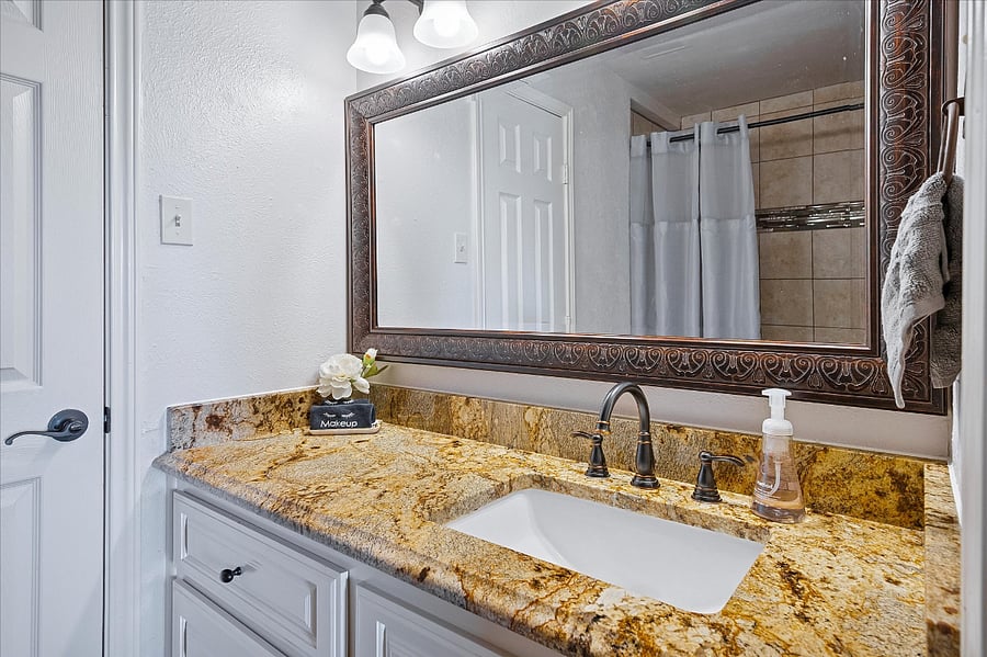 Full bathroom with a combination shower and bathtub for added comfort and convenience