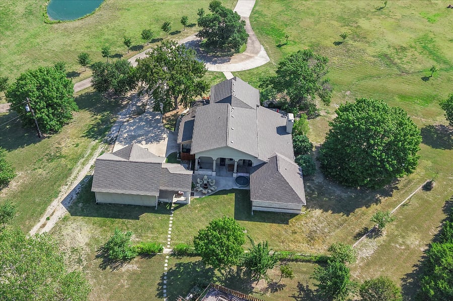 Stunning aerial view of the property highlighting its spacious layout and natural surroundings