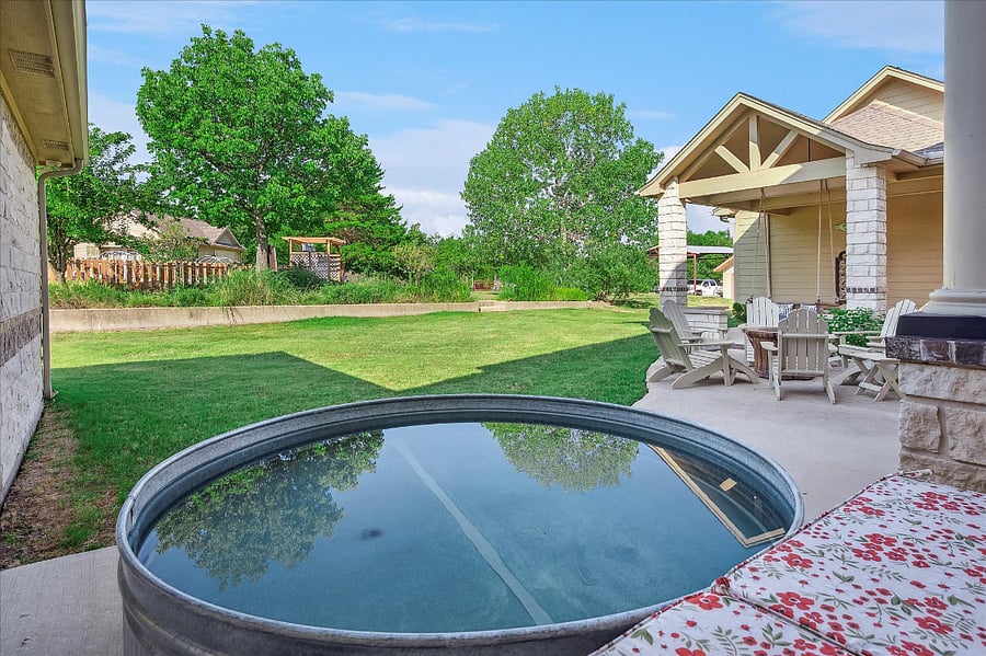Unwind in the cowboy pool while taking in breathtaking sunsets and peaceful nature views under expansive Texas skies