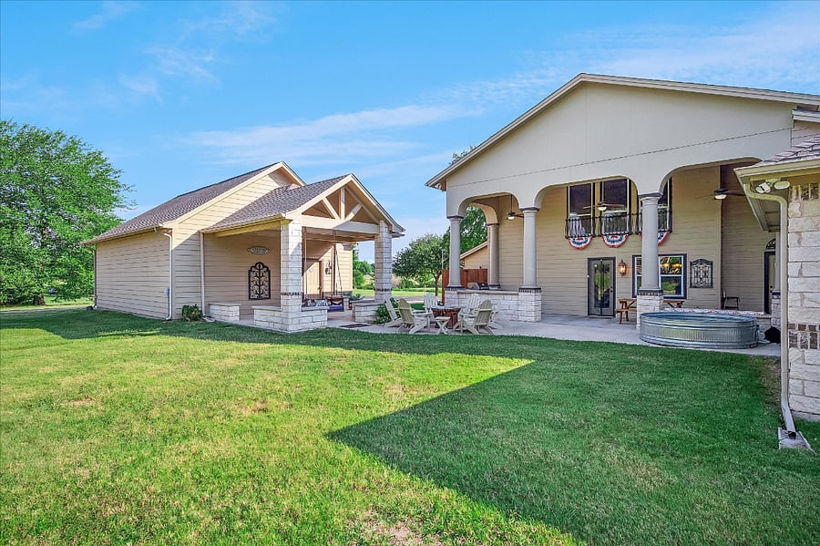 Expansive backyard with peaceful nature views, perfect for outdoor games, gatherings, and relaxation