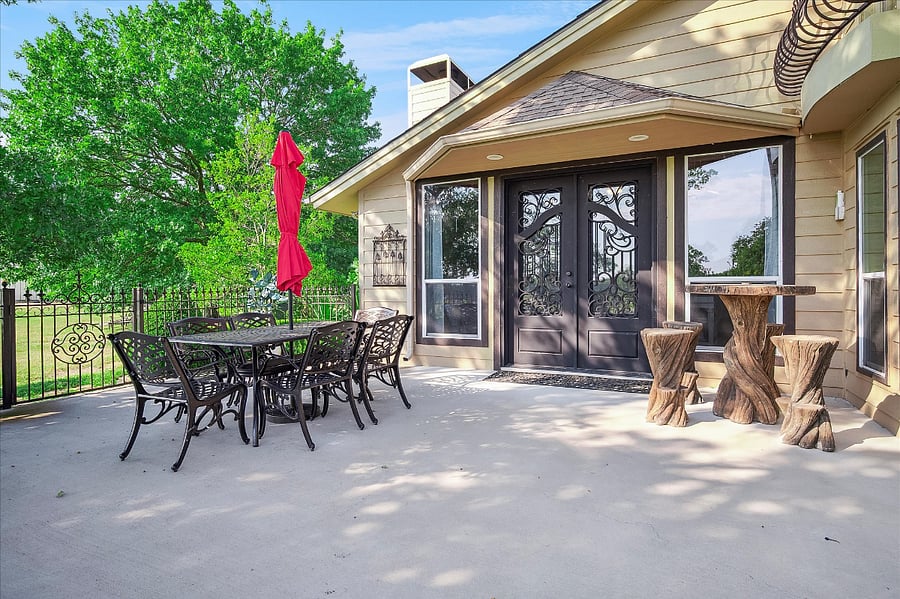Front patio overlooking the pond with breathtaking sunrises an ideal spot to enjoy a peaceful, quiet start to your day with your favorite tea or coffee.