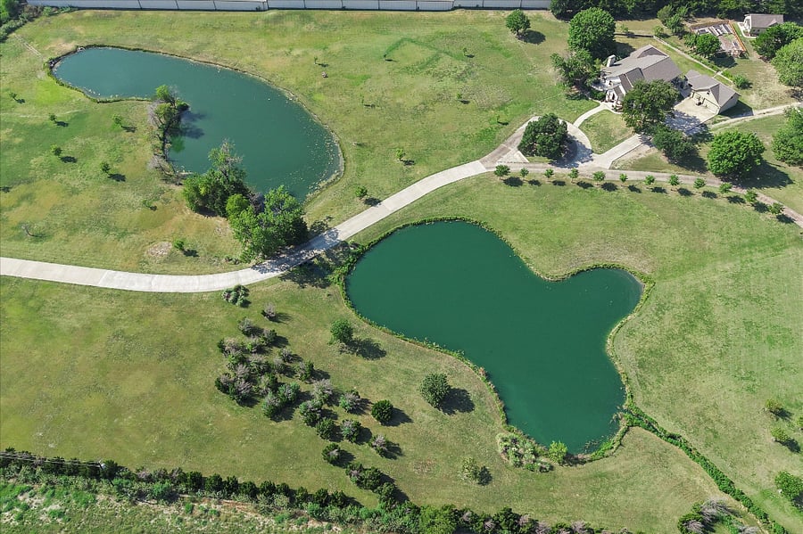 Stunning aerial view of the property highlighting its spacious layout and natural surroundings
