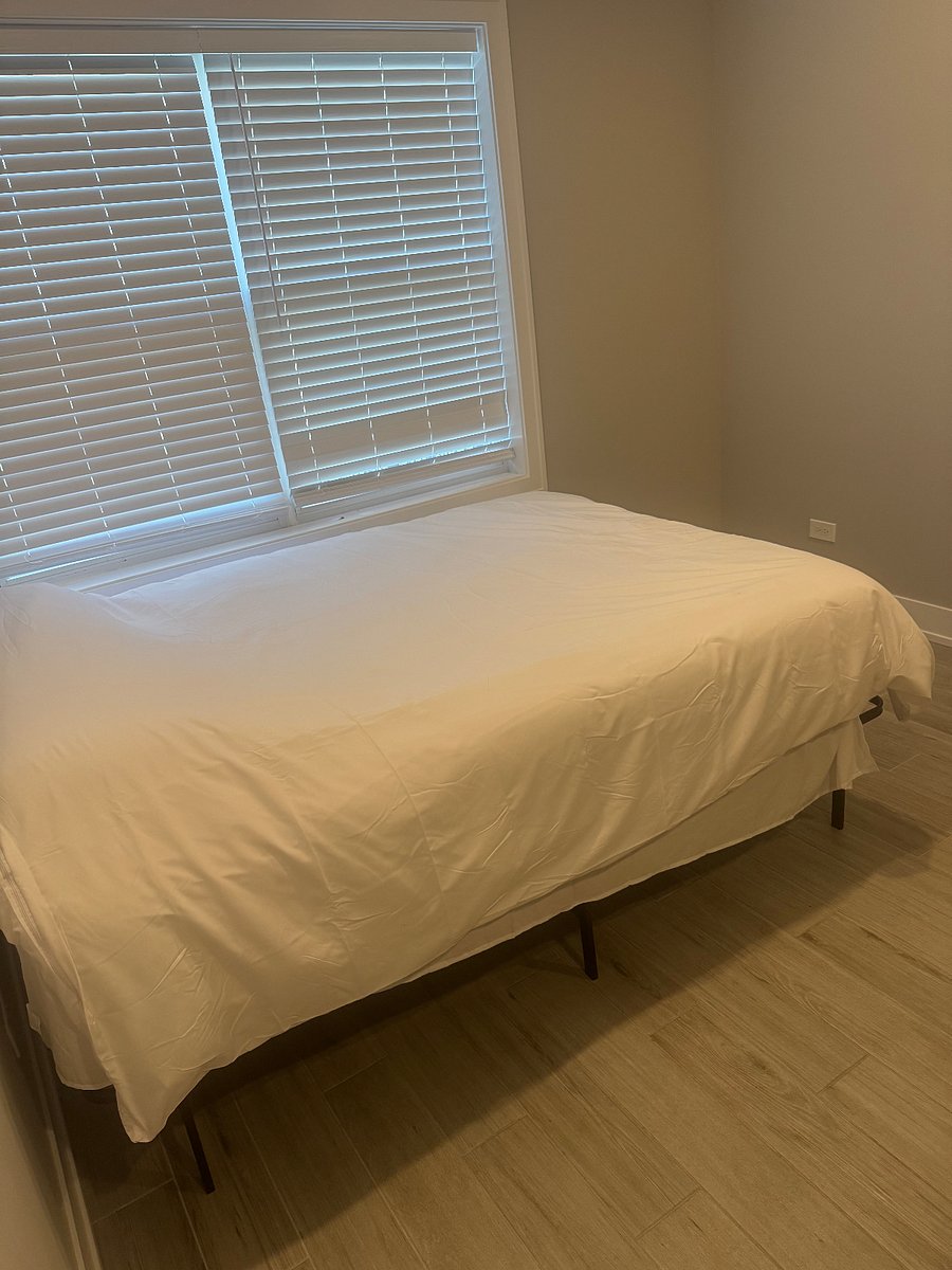 Bedroom 4- large room with 55 inch tv couch and full bathroom