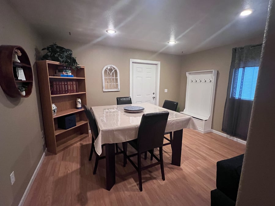 Dining area with table for 4, games, etc.