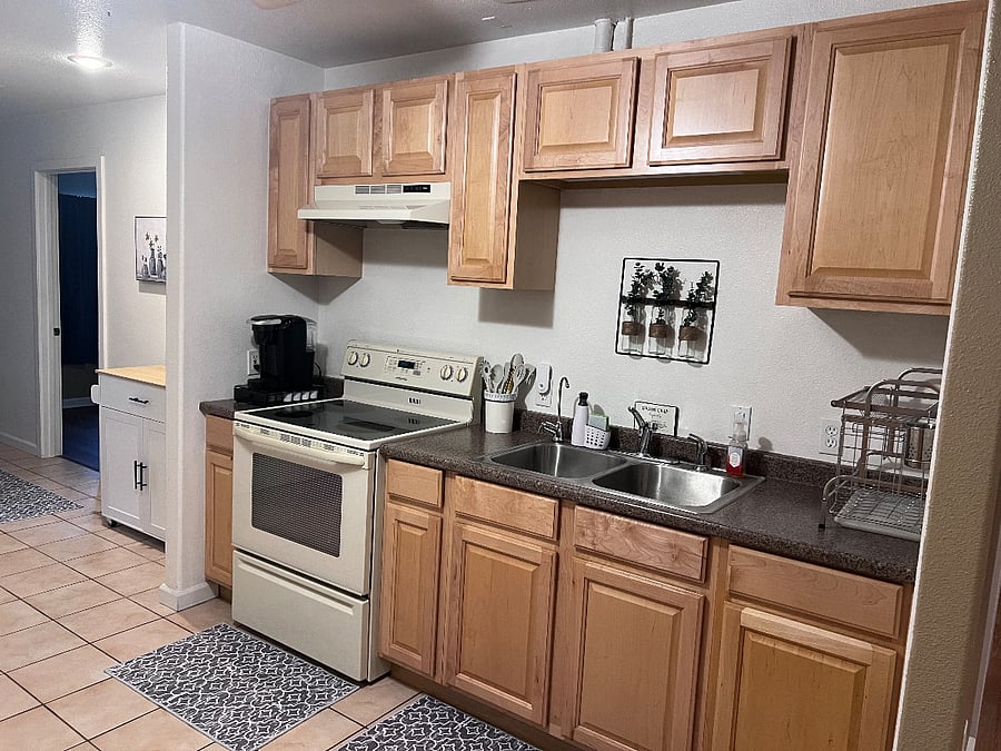 Kitchen with full size stove & cooktop.