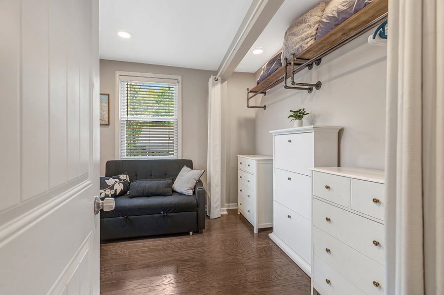 Bedroom #2 with dedicated working space and couch that converts to a bed.