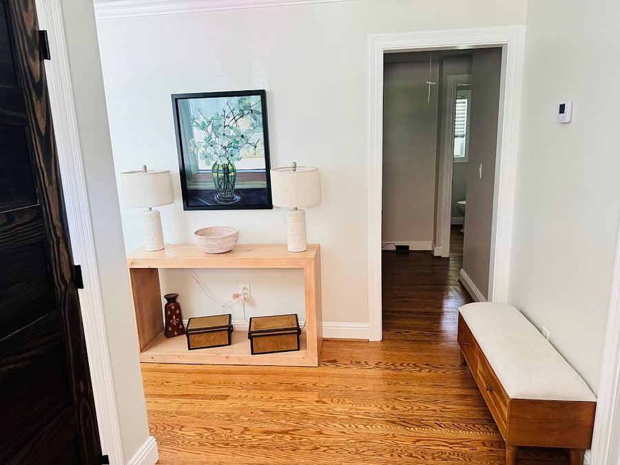 Welcoming entryway with thoughtful touches throughout the home and a coat closet